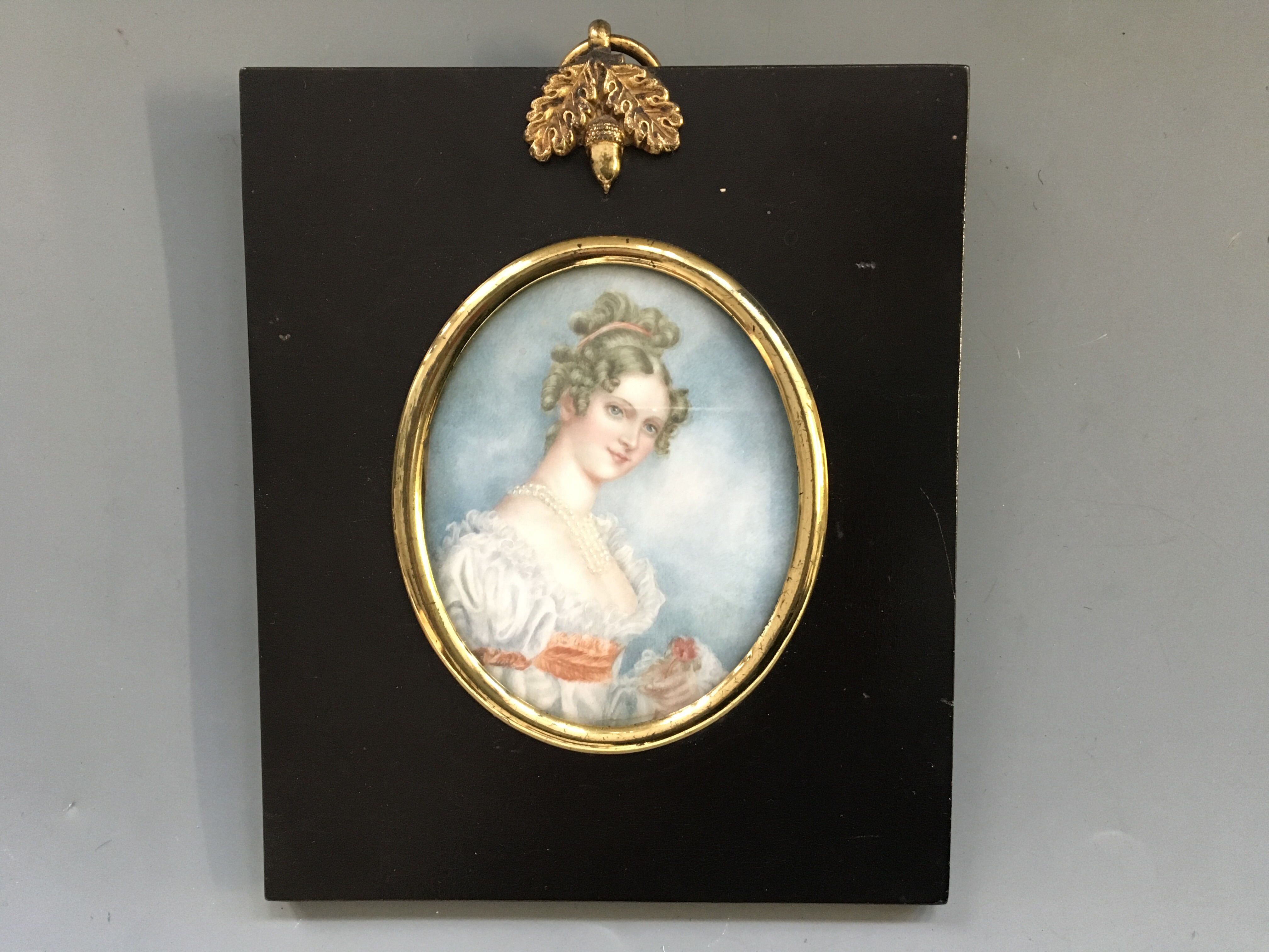 Three framed miniature portraits, one signed ALICE M. COLEY, titled ‘Portrait of an Old Woman’ and