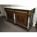 A Louis XV style marble top sideboard, with brass trim.