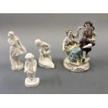 A German figurine group couple with cat and bird, together with three Royal Worcester blank