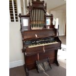 Late 19th century mahogany cased pedal organ with decorative pipe and mirror back.