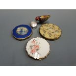 Two Stratton compacts, a Vogue compact, small ornate trinket box and a clock work bird by Preston