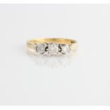 A hallmarked 18ct yellow gold three stone diamond ring, set with three graduated round brilliant cut