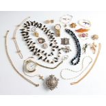 A collection of costume jewellery to include a string of blister pearls, brooches, beads, a wrist