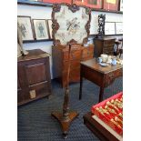 A Victorian Rosewood pole screen with embroidered bird decoration on base.