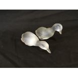 Two Baccarat crystal duck figurines.