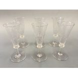 A set of six wheel etched flutes. Height 15.5cm.