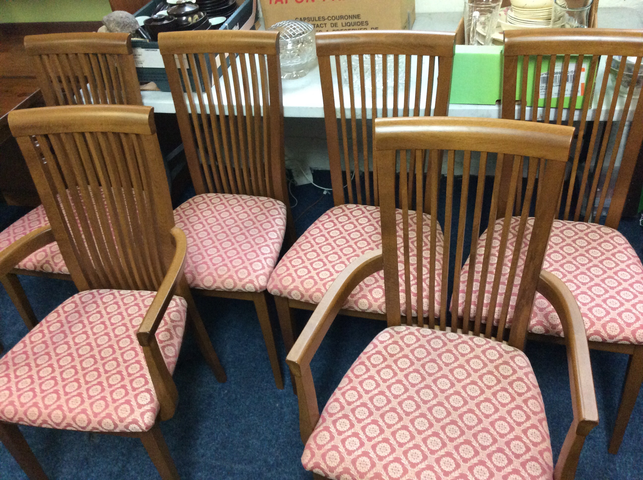 Teak extending dining table together with six chairs and sideboard base.