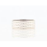 An 18ct white gold wedding band, with bright cut engraved design, hallmarked London.