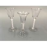 Three glasses, one with air twist and two with opaque twist stems. Heights 17cm and 18cm.