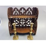 A two tier Gothic Style shelf unit and pair of 19th century brass candlesticks.