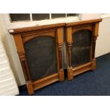 A pair of oak framed wall mounted menu boards.