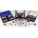 A collection of hallmarked silverware to include a cruet set, a boxed set of six teaspoons, two