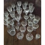 Large quantity of cut glass drinking glasses.