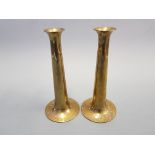A pair of Torben Orskov and Co Denmark Arts and Craft brass candlesticks.