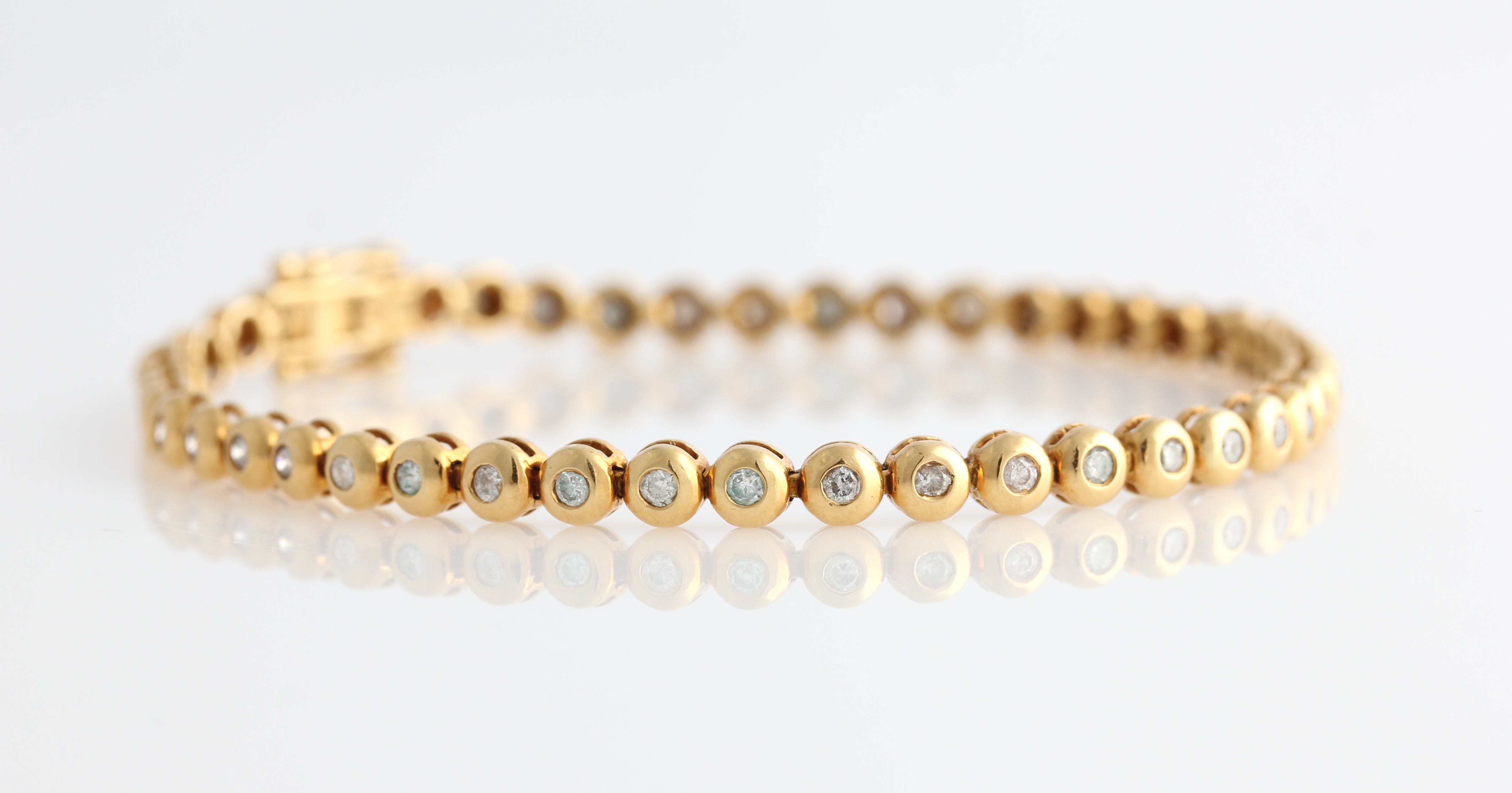 A hallmarked 18ct yellow gold diamond tennis bracelet, each articulated circular link set with a