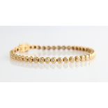 A hallmarked 18ct yellow gold diamond tennis bracelet, each articulated circular link set with a