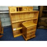 A pine four door multi shelf cupboard, a pine three tier open bookshelves, together with a pine