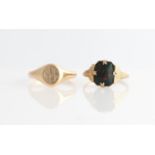 A bloodstone set signet ring and a monogram engraved signet ring, both unmarked yellow metal, (2).