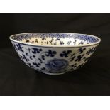 A blue and white rose patterned Chinese bowl with blue character marks to base, height 8.5cm,