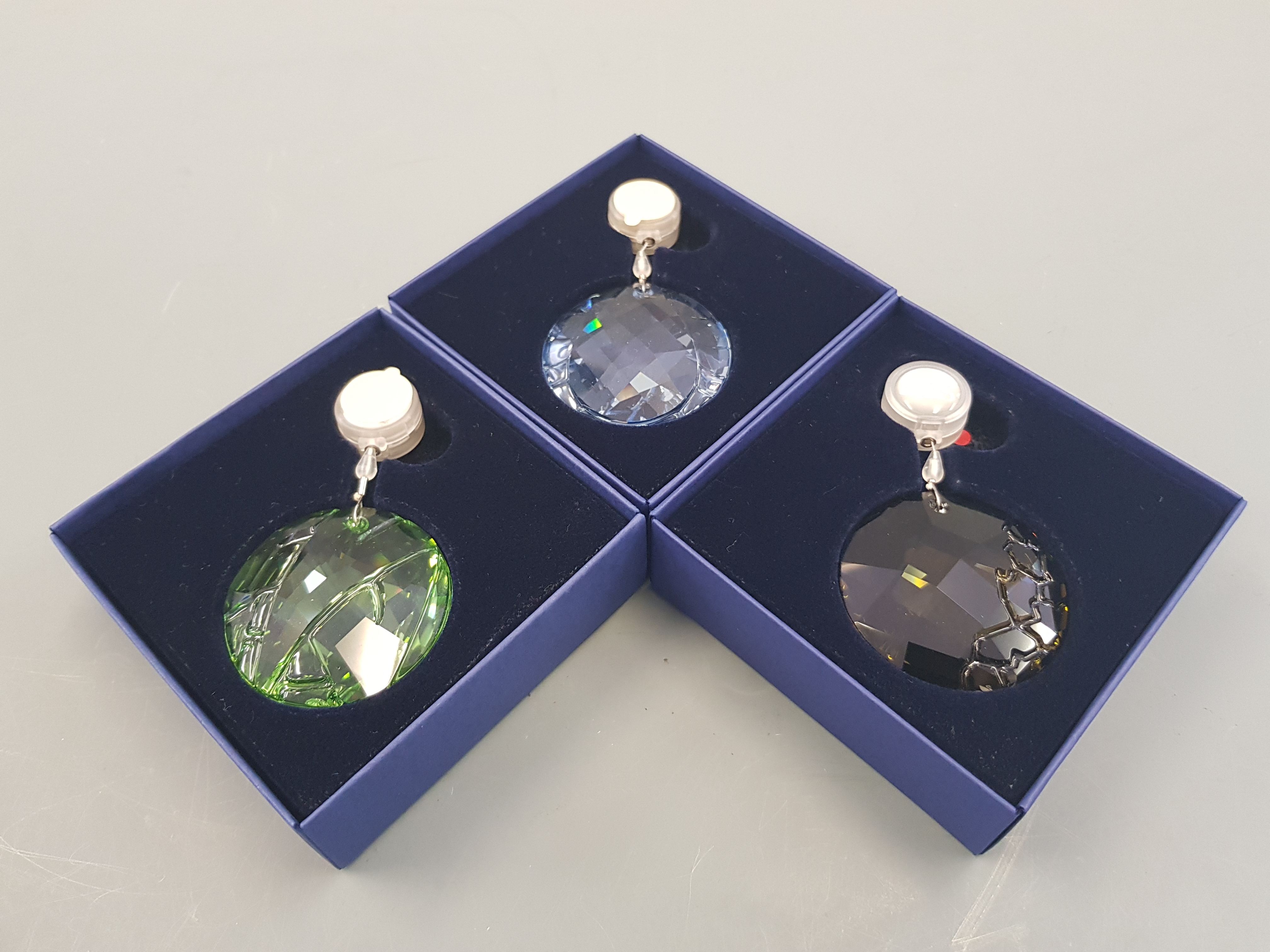 Three boxed Swarovski crystal hanging ornaments.