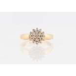 A hallmarked 9ct yellow gold diamond cluster ring, set with eight-cut diamonds in tiered design,