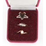 A hallmarked 9ct yellow gold smoky quartz and diamond ring, a three stone diamond ring and a