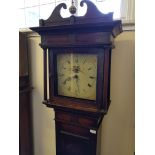 An oak long cased clock with painted dial with bird decoration.