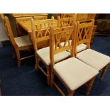 A reproduction pine kitchen dresser, drop leaf table on pedestal base, and six matching chairs