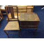 A walnut reproduction table, walnut sewing box cabinet and bedroom chair.