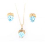 A part suite of blue topaz jewellery, comprising a pendant and chain and a pair of earrings, each