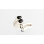 A Regitze Overgaard for Georg Jensen pair of rings, each ring of crossover design set with a