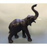 A leather elephant with tusks. Approximately 52cm x 46cm.