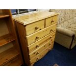 A pine chest of two short over four long drawers.