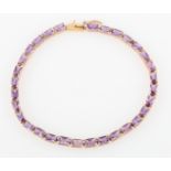 A hallmarked 9ct yellow gold amethyst line bracelet, set with rectangular cut amethysts, length