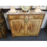 A French mahogany cabinet fitted, two drawers with brass handles, top on small turned supports.