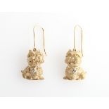 A pair of 9ct yellow gold novelty drop earrings, each modelled as a Westie, set with a diamond