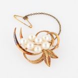 A Mikimoto pearl brooch, set with seven variously sized pearls, smallest measuring approx. 6mm and
