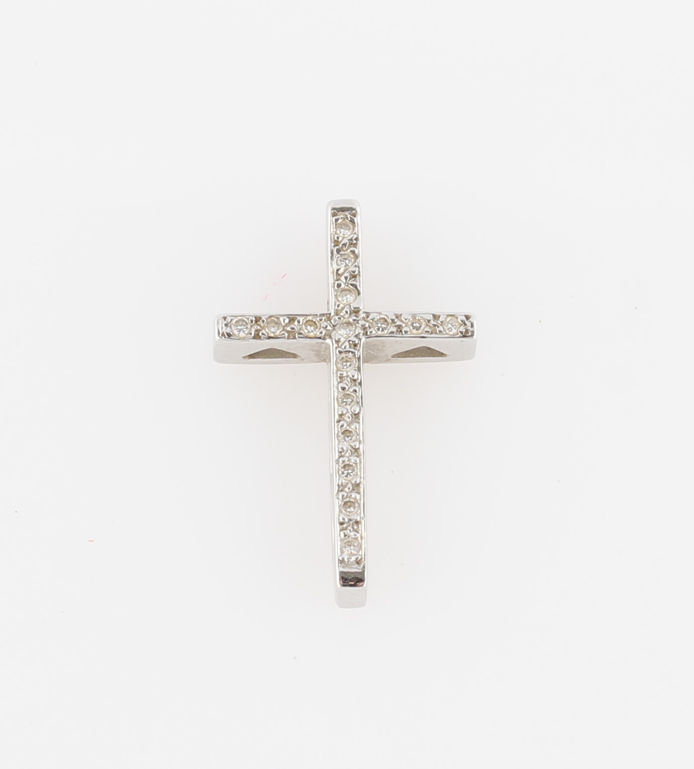 *A diamond set cross pendant, set with round brilliant cut diamonds, stamped 750 (rubbed).