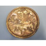 A Japanese bronze plate depicting figures in garden scene - on back embossed character mark, 30.