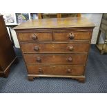 A 19th Century oak chest of two short over three long drawers on bracket feet.