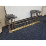 A brass fire kerb with fitted stool either end.