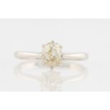 A diamond solitaire ring, set with an old cut diamond, measuring approx. 0.60ct, stamped 18ct,