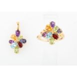 A part suite of multi-gemstone jewellery, comprising a ring and pendant, each set with amethyst,