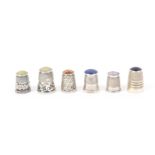 Six English silver hallmarked thimbles all with polished stone tops including one with mistletoe