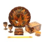 Fern ware - seven pieces comprising a shaped border circular dish, coloured ferns on a brown ground,