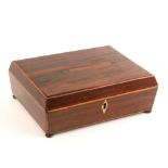 A Regency rosewood sewing box of shallow sarcophagal form, edged in boxwood, ivory diamond