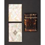 Three card cases comprising a purse form mother of pearl example inset white metal cartouche, repair
