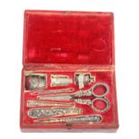An early 19th Century red leather rectangular sewing box with a full complement of silver