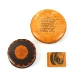 Mauchline ware - two snuff boxes and another comprising a small example, wooden hinge, the lid