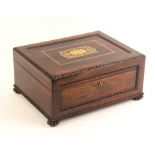 A George IV rosewood sewing box of rectangular form with bobbin beaded quarter mouldings and inset